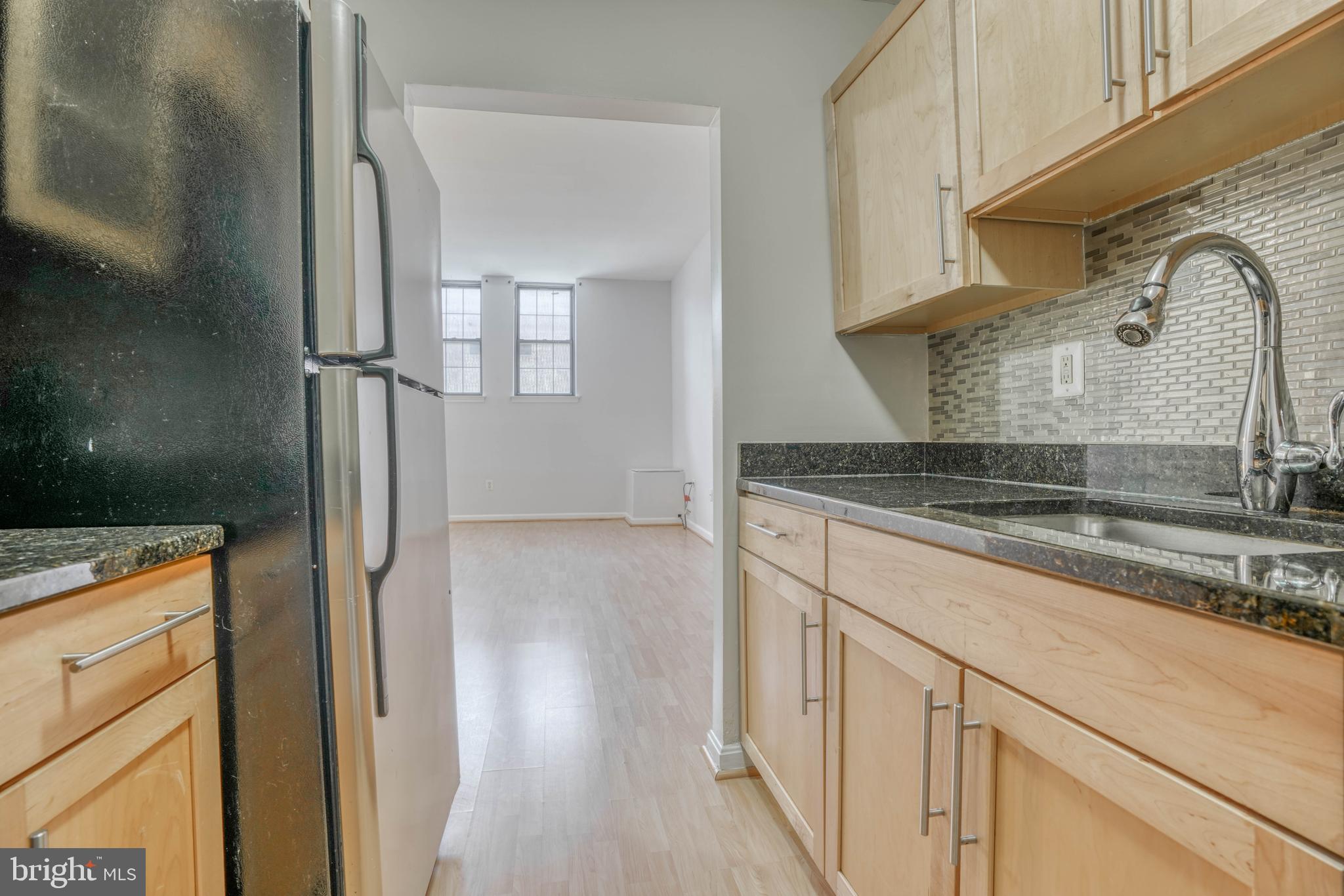 1011 Hunter Street, Unit G1 Baltimore, MD 21202 - Photo 10 of 17 Kitchen into Living Room