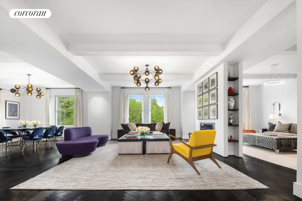 a living room with furniture wooden floor and a chandelier