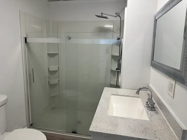 a bathroom with a sink and toilet