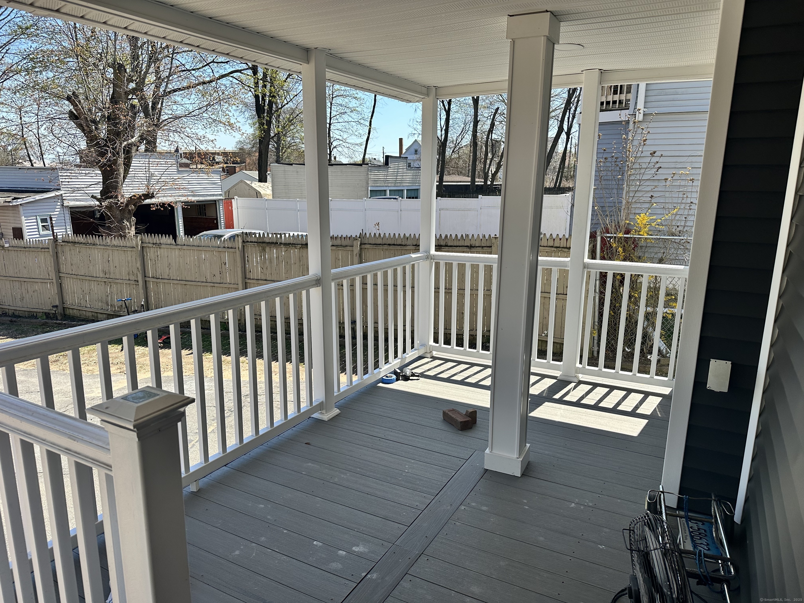 1049 Campbell Avenue West Haven, CT 06516 - Photo 18 of 20 a view of a balcony with wooden floor and door