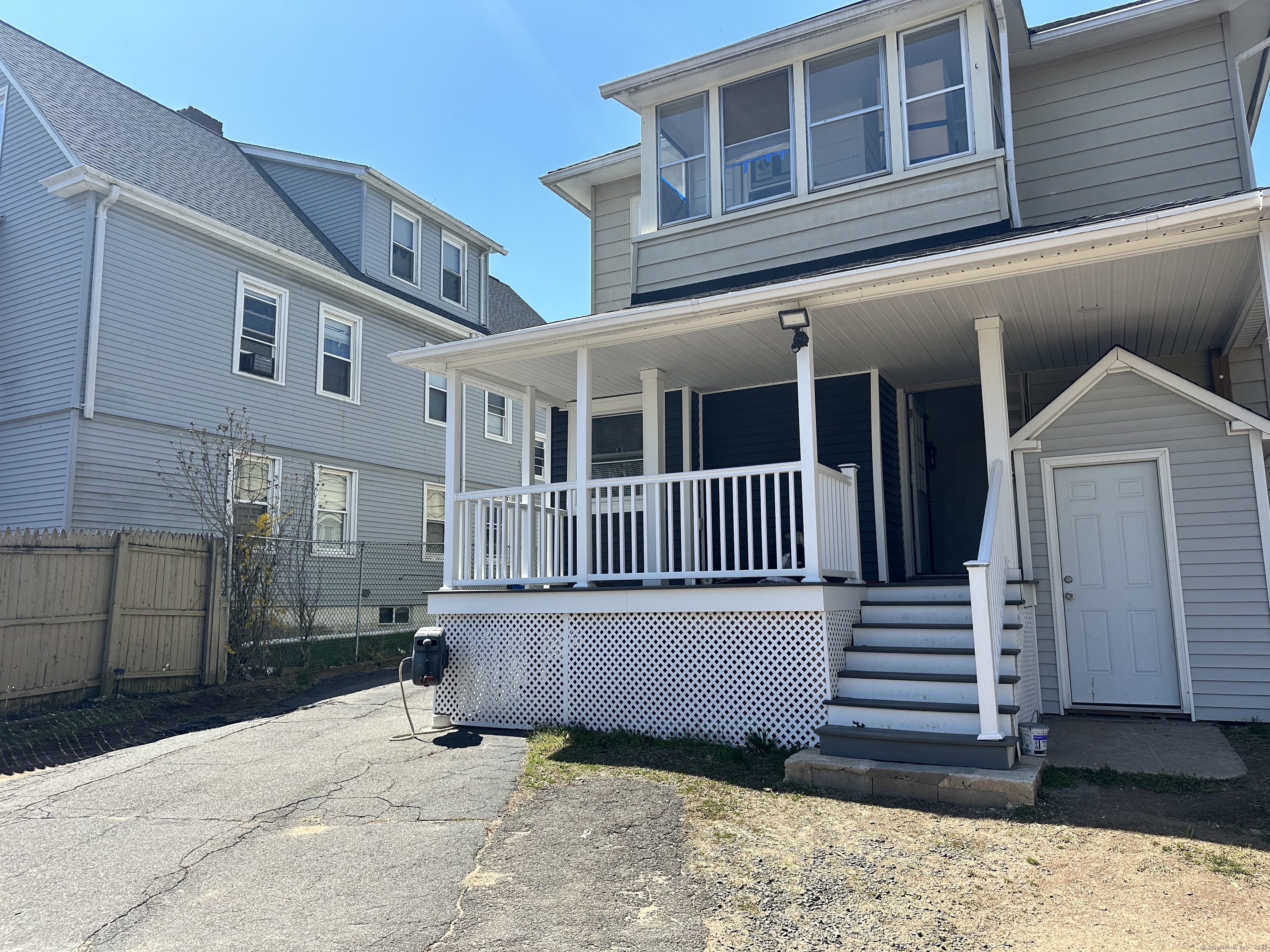 1049 Campbell Avenue West Haven, CT 06516 - Photo 19 of 20 a view of a house with a yard