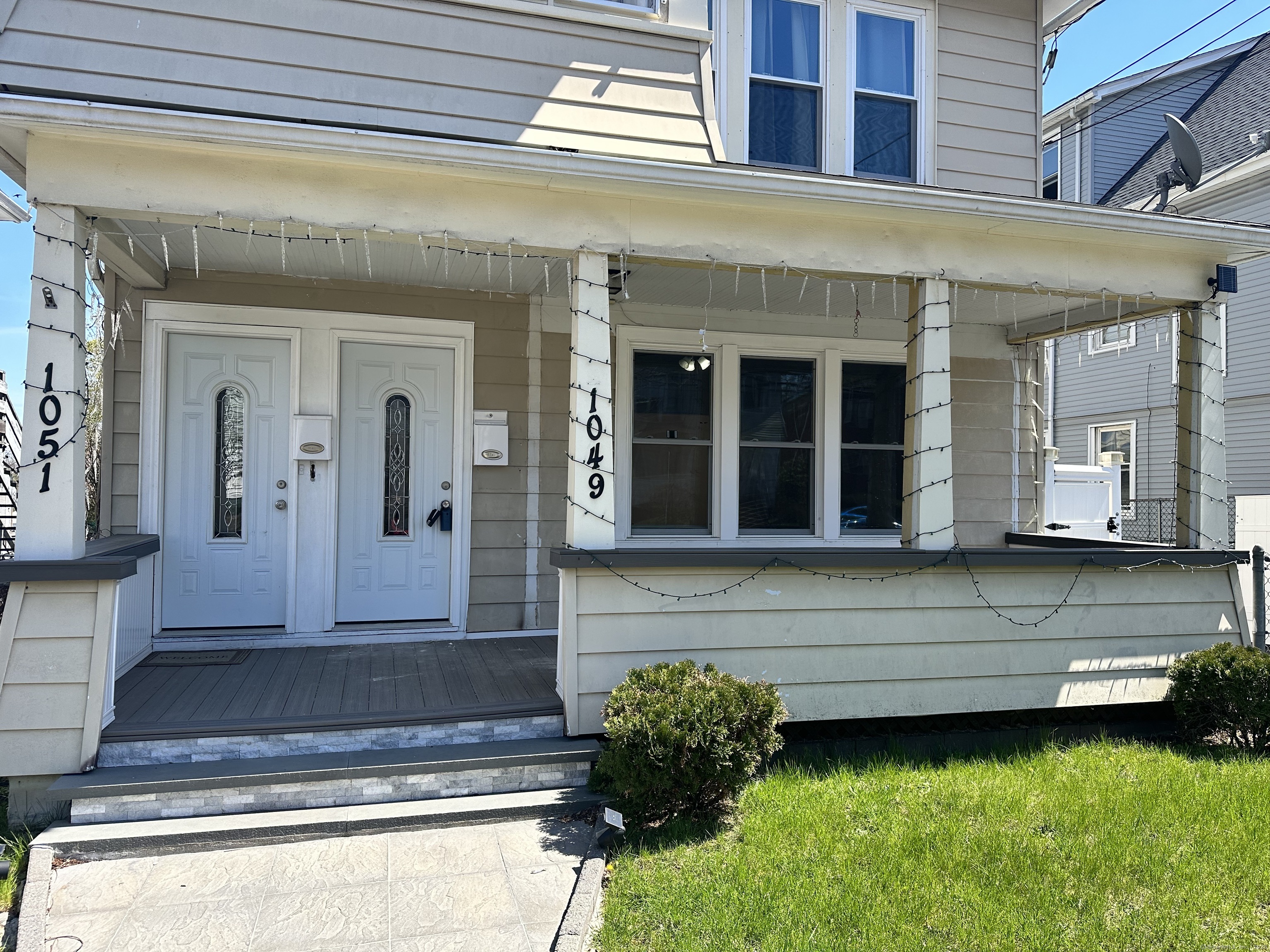 1049 Campbell Avenue West Haven, CT 06516 - Photo 2 of 20 a front view of a house with a yard