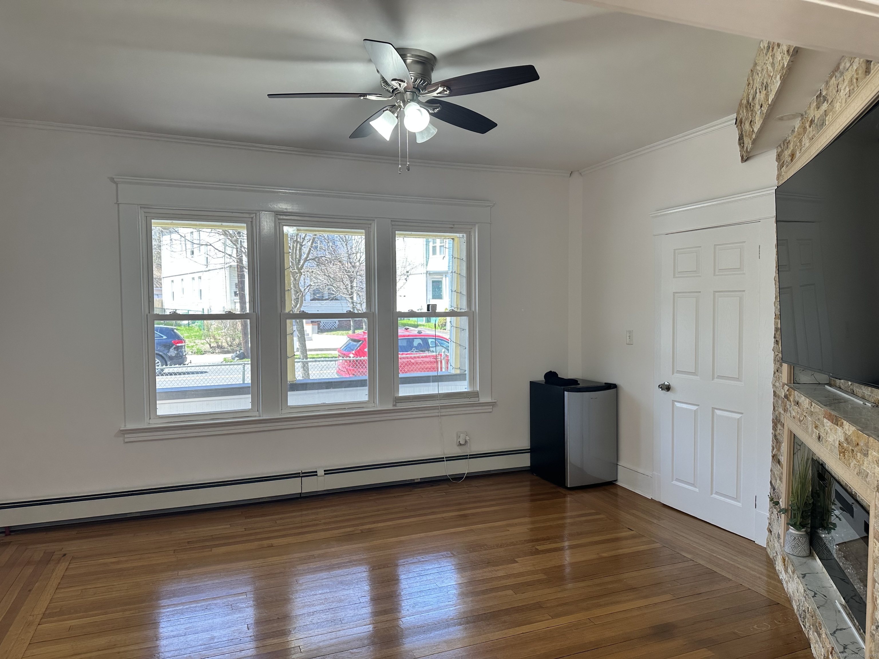 1049 Campbell Avenue West Haven, CT 06516 - Photo 7 of 20 an empty room with windows and fireplace