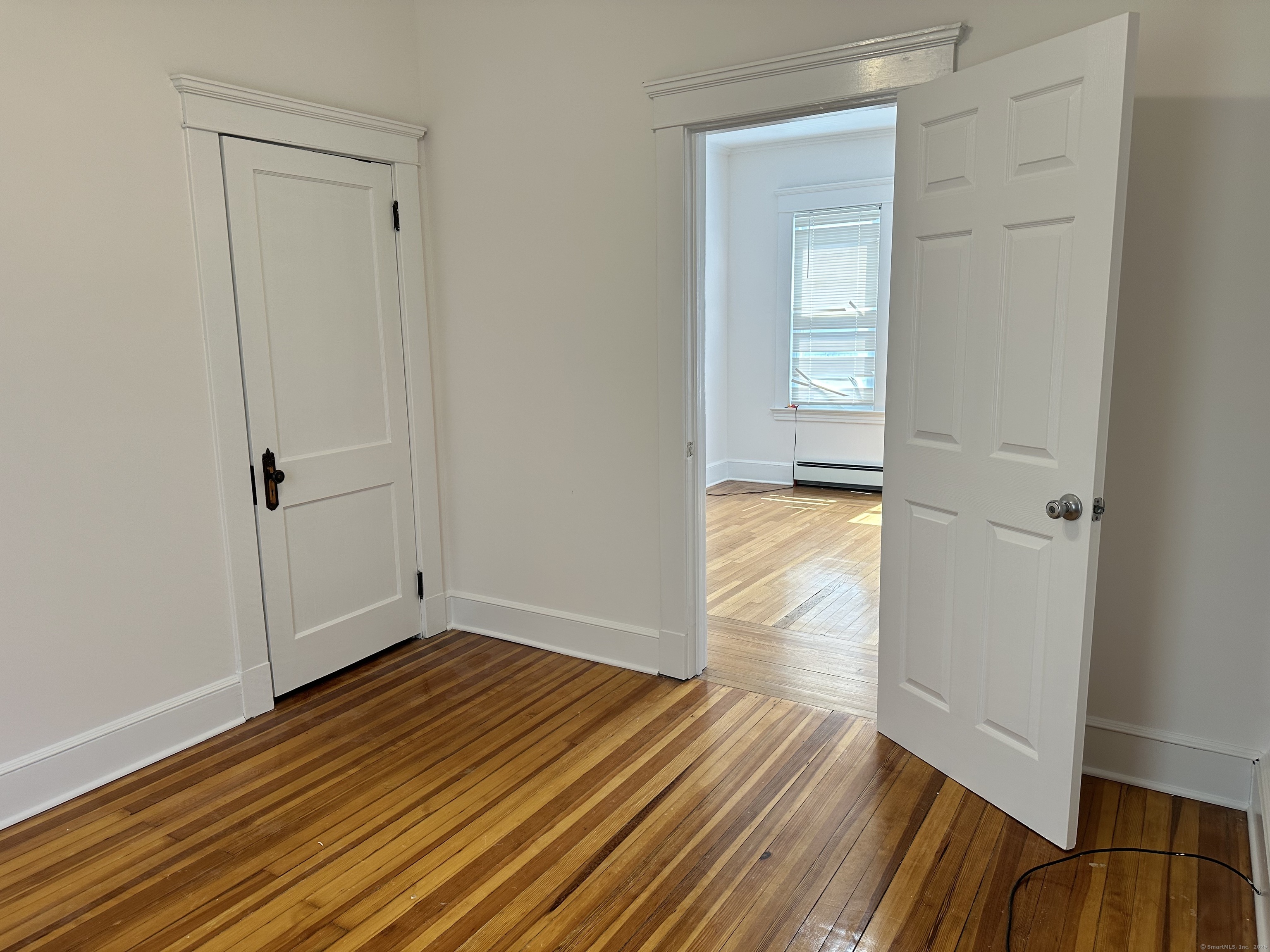 1049 Campbell Avenue West Haven, CT 06516 - Photo 9 of 20 a view of a room with wooden floor and closet