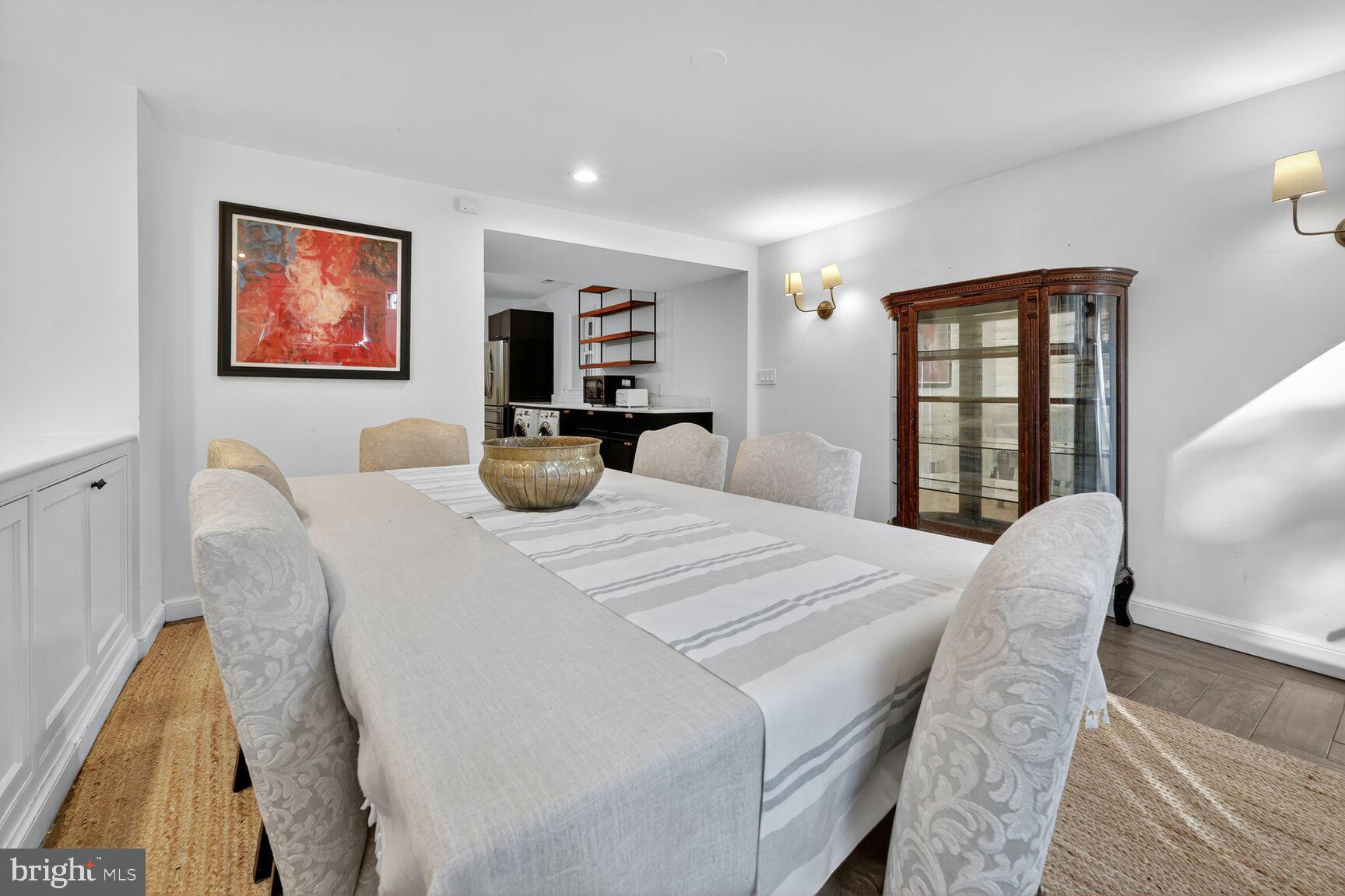 1511 34th Street Northwest Washington, DC 20007 - Photo 11 of 30 a bedroom with a bed and a large mirror next to a window