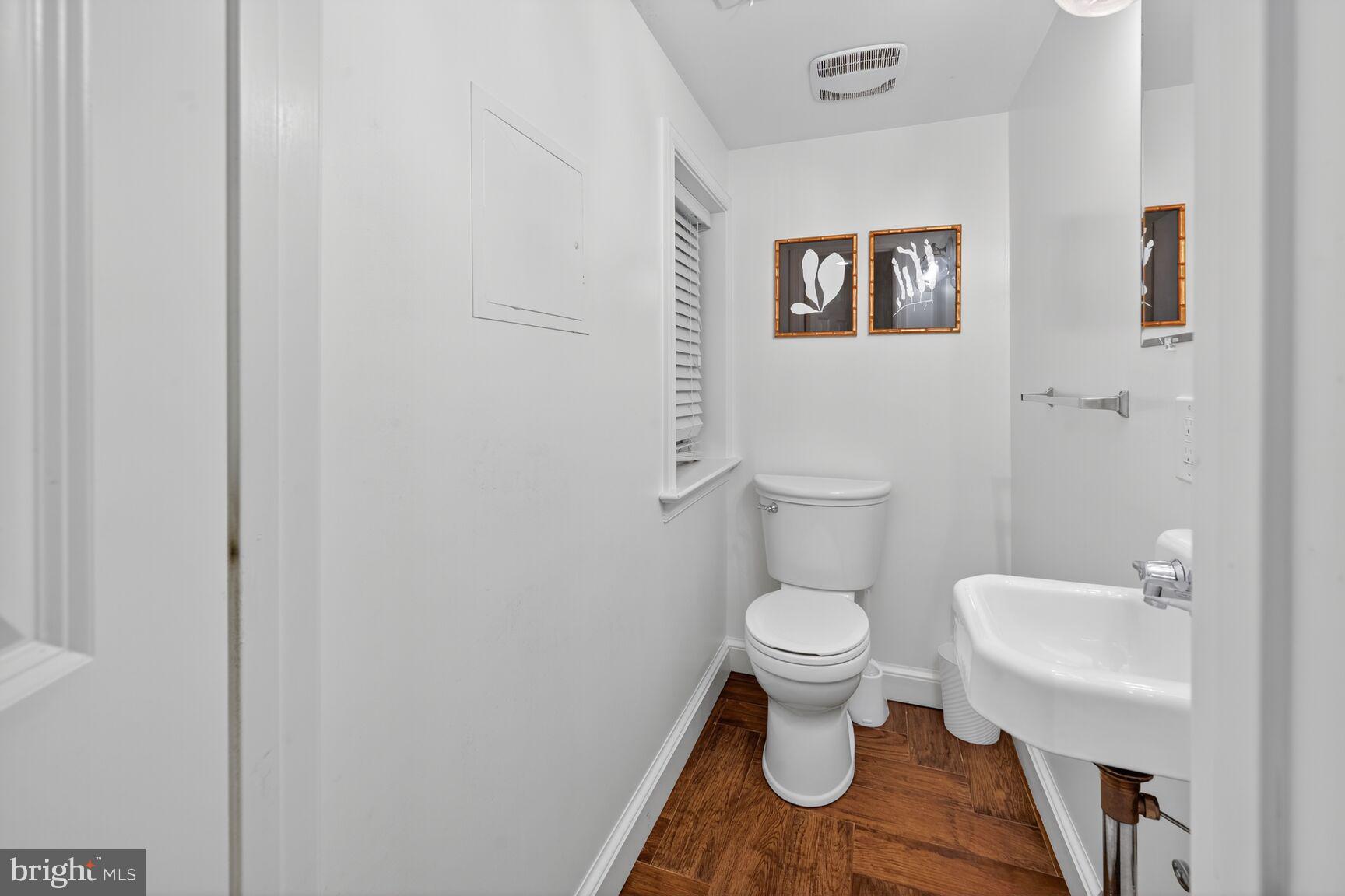 1511 34th Street Northwest Washington, DC 20007 - Photo 14 of 30 a bathroom with a toilet and a sink