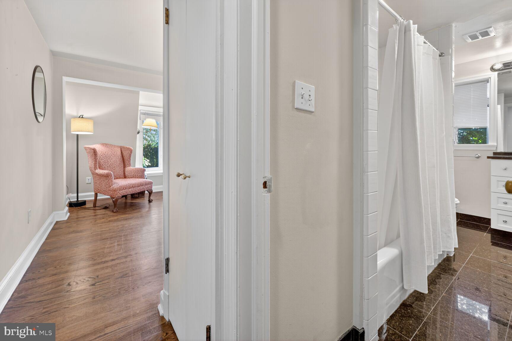 1511 34th Street Northwest Washington, DC 20007 - Photo 16 of 30 a view of a hallway with bathroom and wooden floor