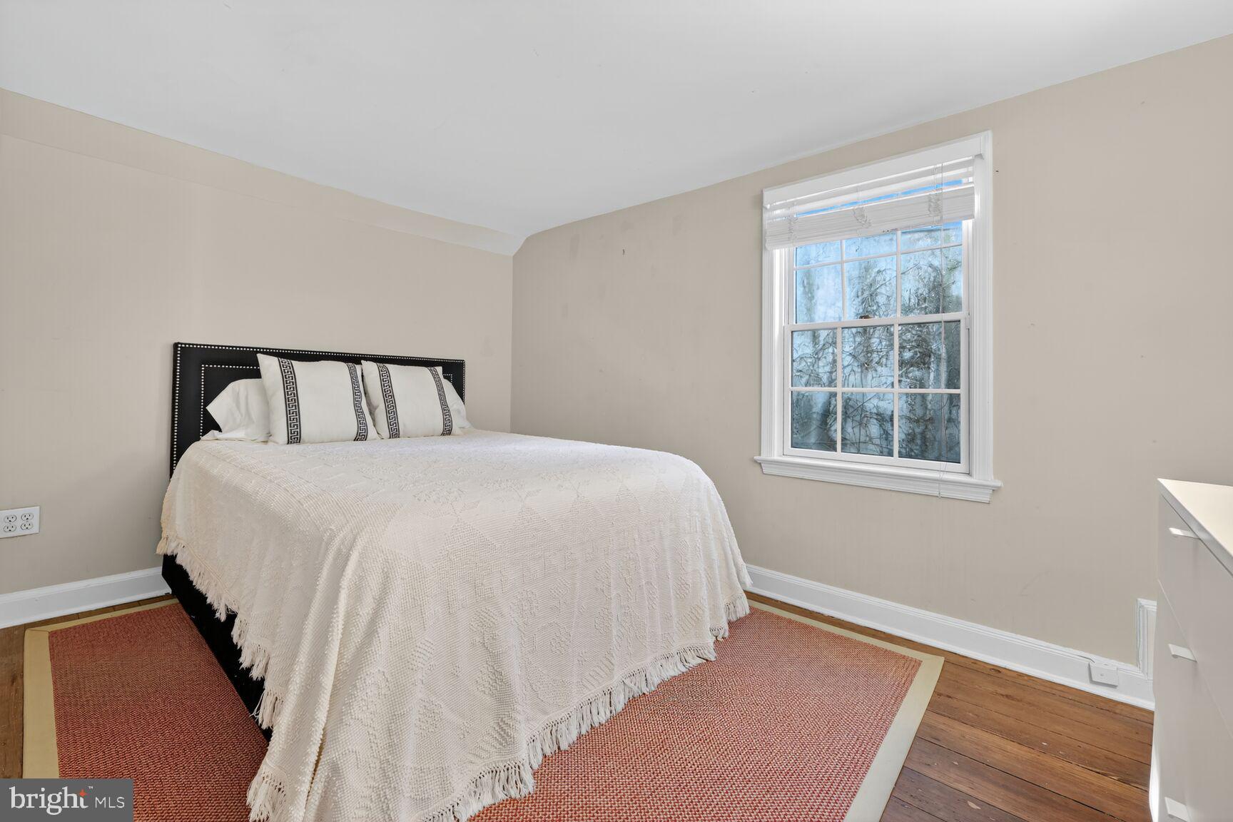 1511 34th Street Northwest Washington, DC 20007 - Photo 24 of 30 a bedroom with a bed and a window