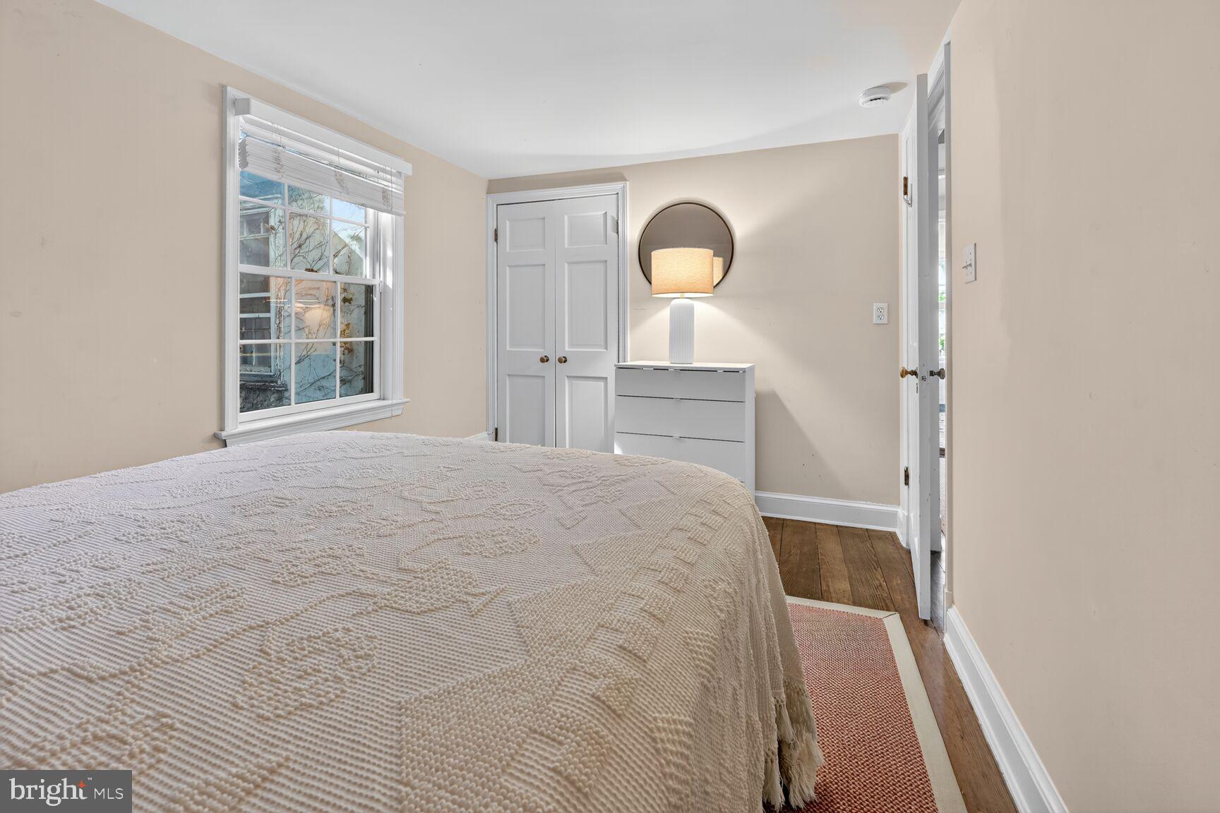 1511 34th Street Northwest Washington, DC 20007 - Photo 25 of 30 a bedroom with a bed and mirror