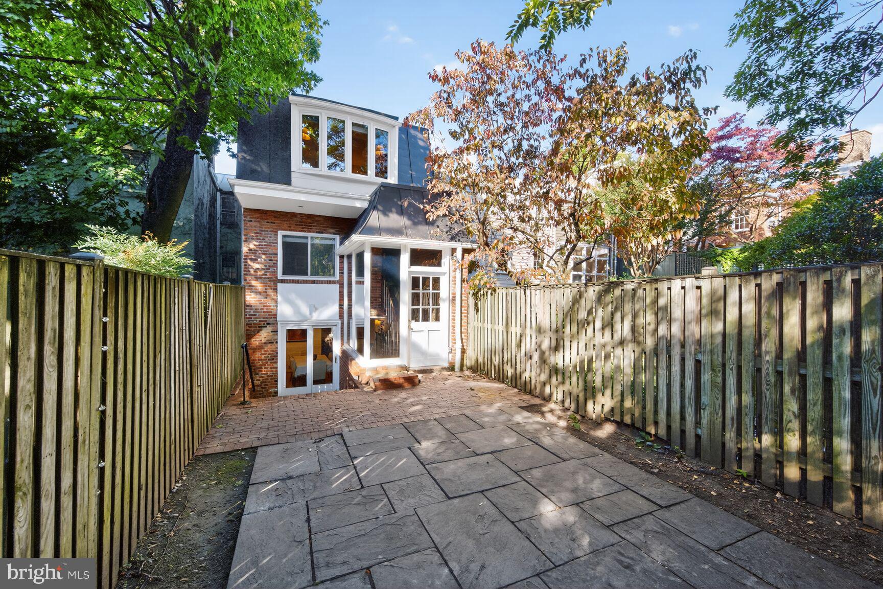 1511 34th Street Northwest Washington, DC 20007 - Photo 29 of 30 a view of a house with a small yard and wooden fence