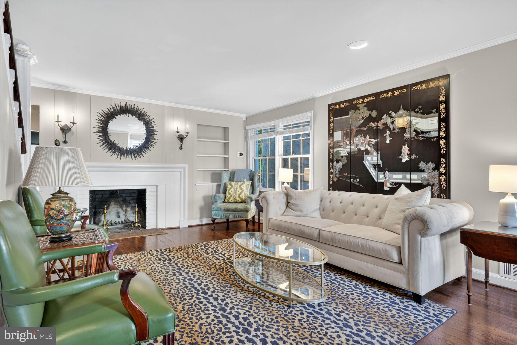 1511 34th Street Northwest Washington, DC 20007 - Photo 3 of 30 a living room with furniture a fireplace and a large window