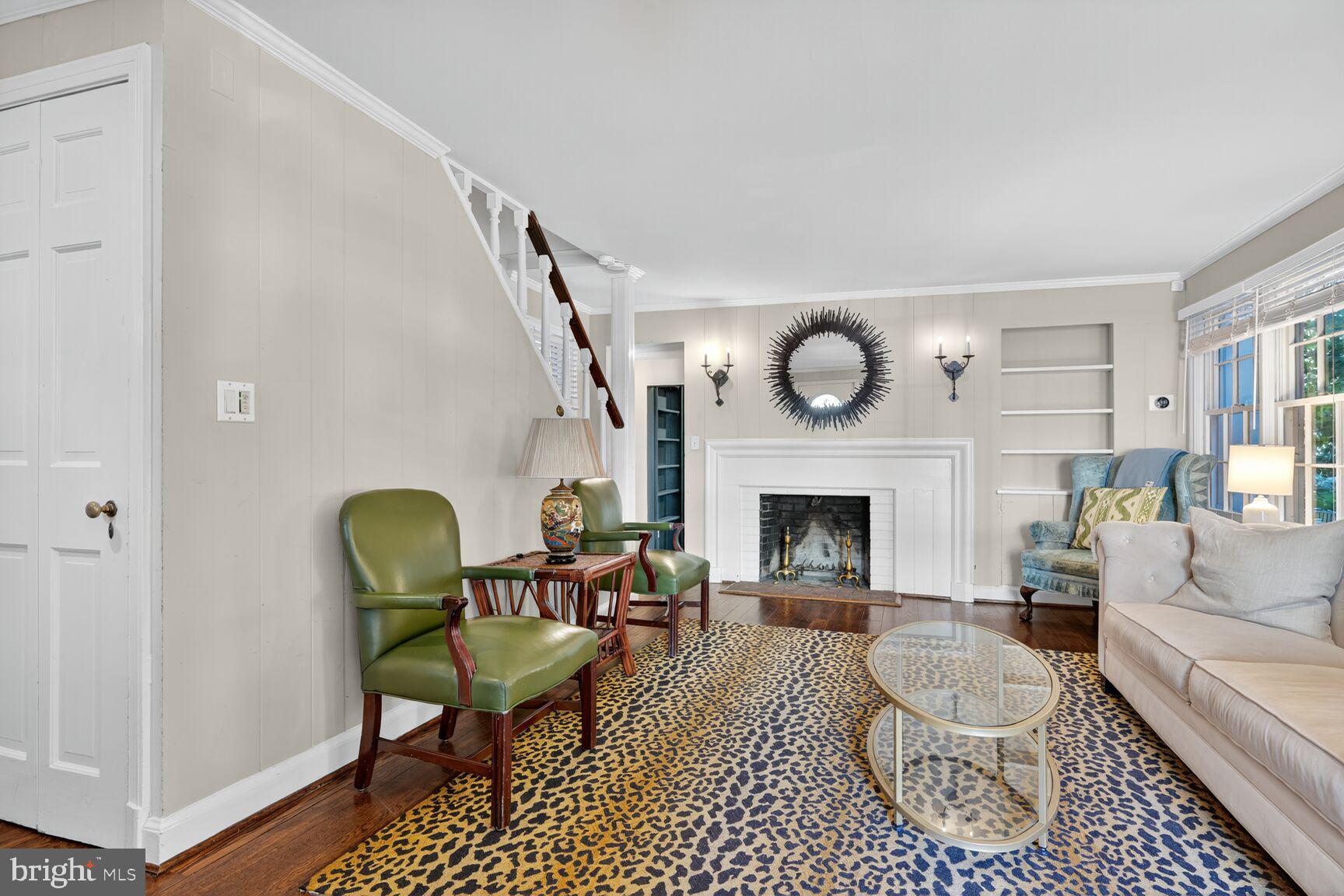 1511 34th Street Northwest Washington, DC 20007 - Photo 4 of 30 a living room with furniture a fireplace and a window