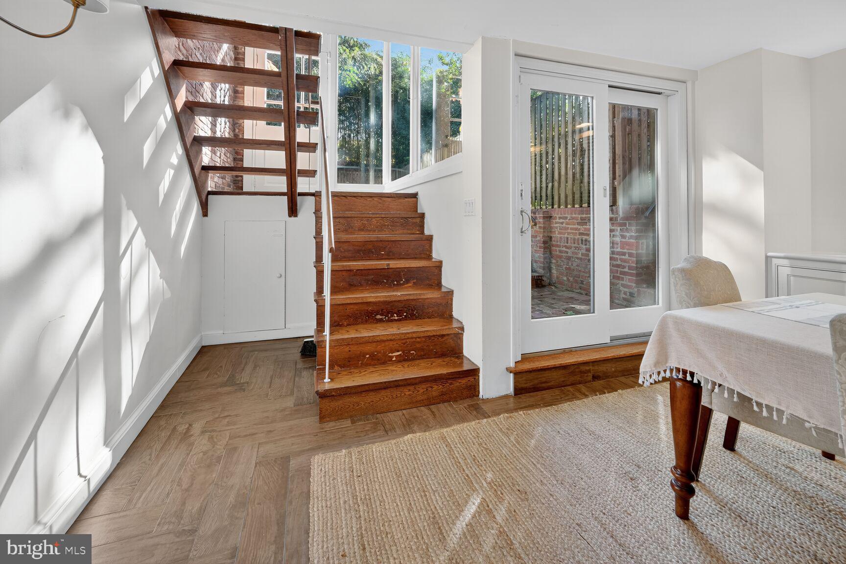 1511 34th Street Northwest Washington, DC 20007 - Photo 9 of 30 a view of entryway with wooden floor and stairs
