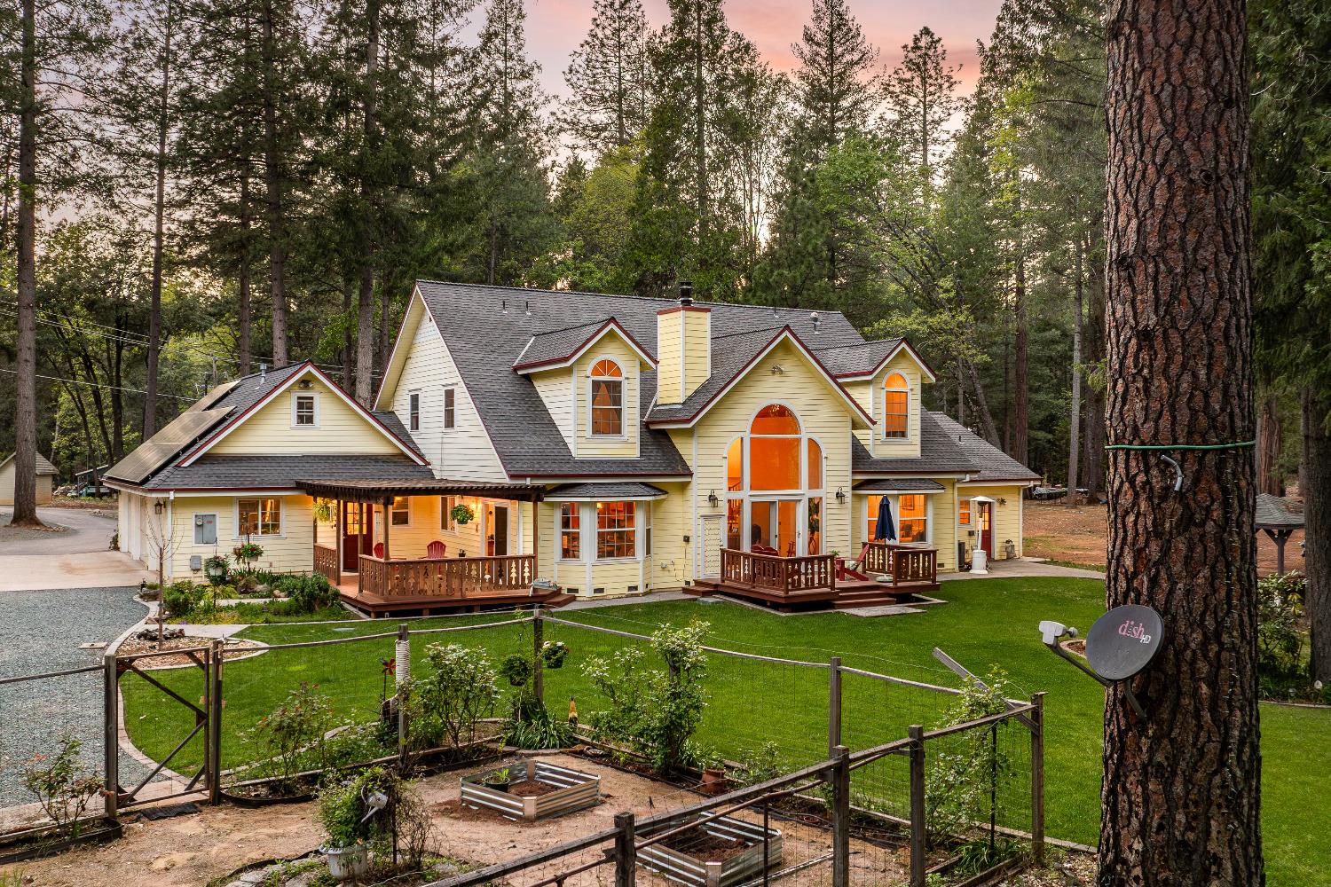 14469 Highland Drive Grass Valley, CA 95945 - Photo 1 of 1 a front view of a house with garden