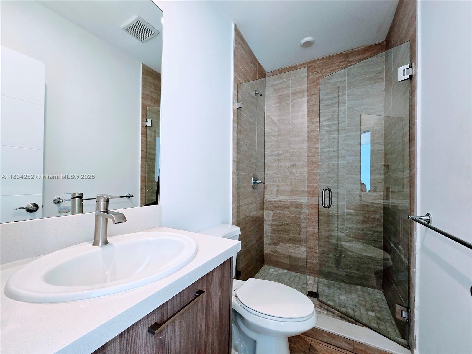 6336 Southwest 27th Street, Unit 8 Miramar, FL 33023 - Photo 11 of 16 a bathroom with a sink toilet and shower