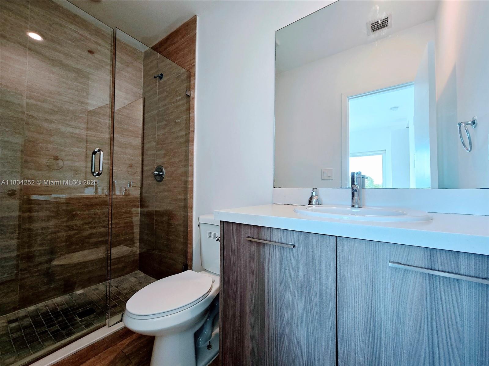 6336 Southwest 27th Street, Unit 8 Miramar, FL 33023 - Photo 15 of 16 a bathroom with a sink toilet and shower