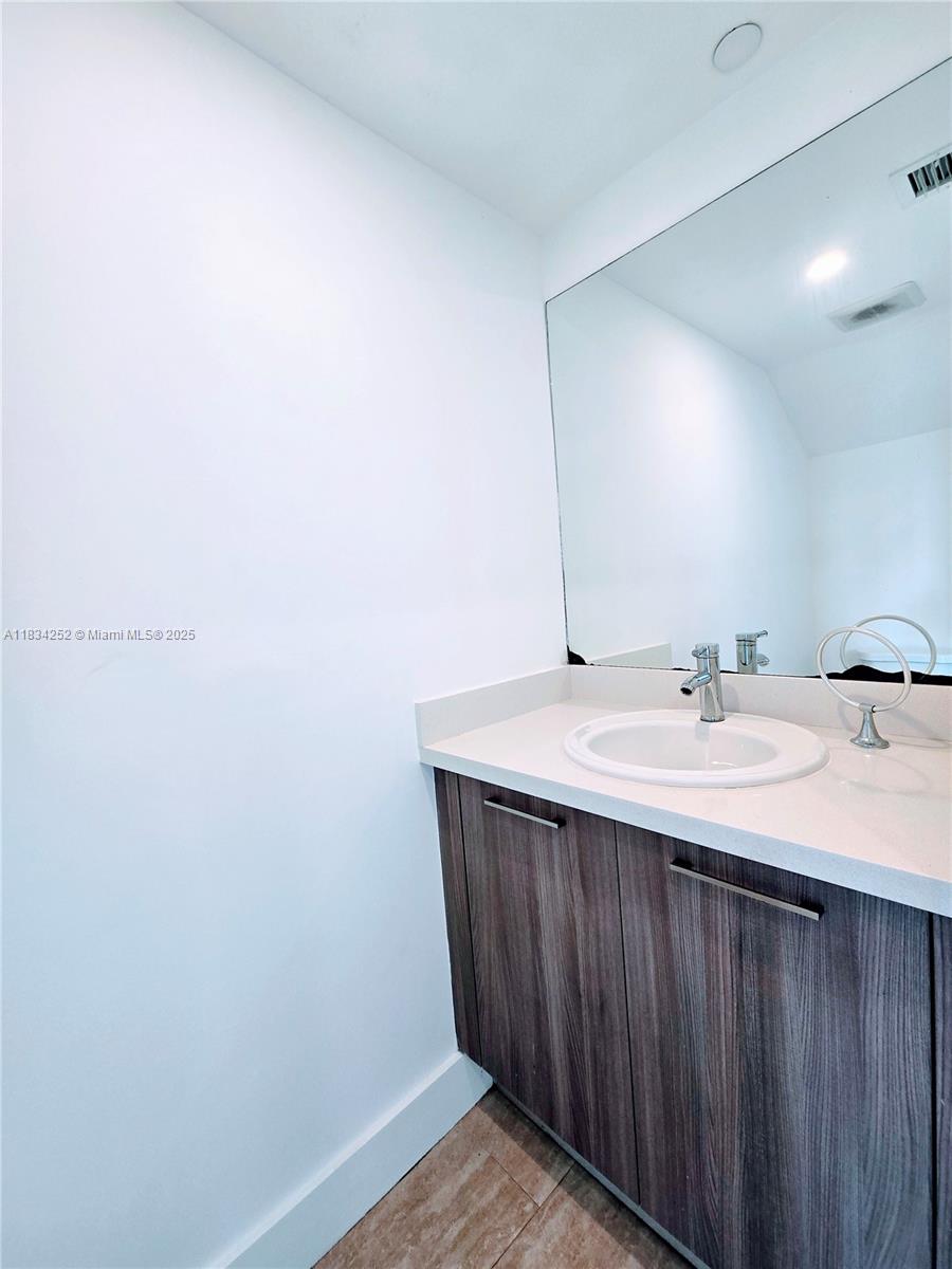 6336 Southwest 27th Street, Unit 8 Miramar, FL 33023 - Photo 6 of 16 a bathroom with a sink and a mirror