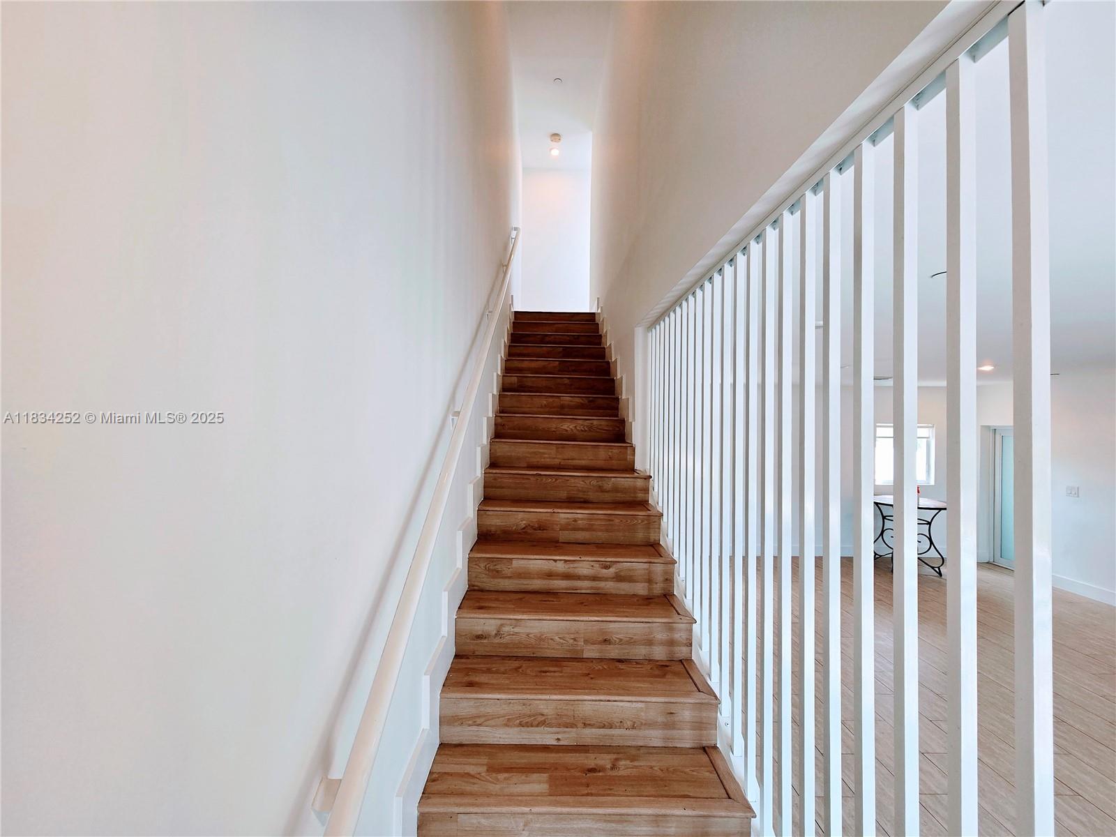 6336 Southwest 27th Street, Unit 8 Miramar, FL 33023 - Photo 8 of 16 a view of a hallway with stairs