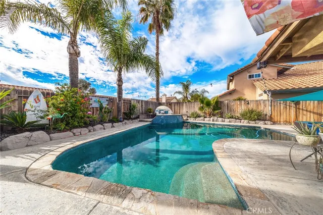 a view of a swimming pool with a patio