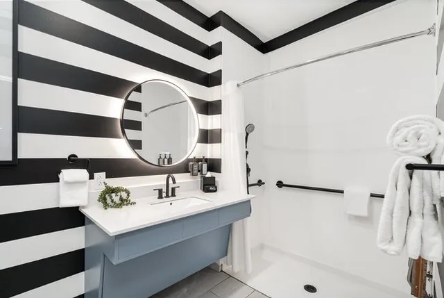 a bathroom with a sink and a mirror