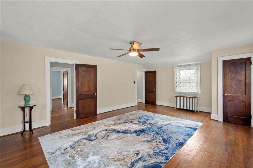 705 Walnut Street Crescent, PA 15046 - Photo 23 of 41 a view of an empty room and window with wooden floor