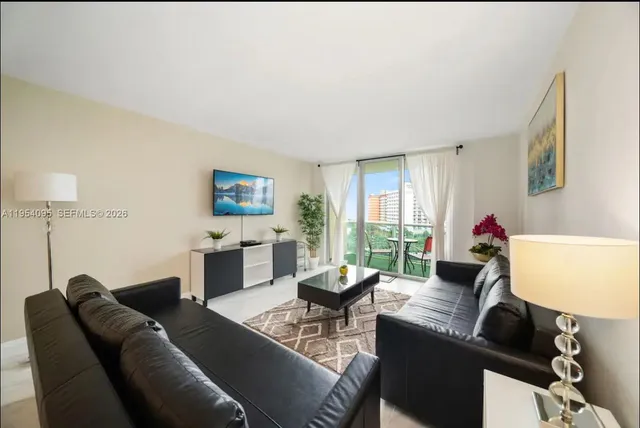 a living room with furniture and a window