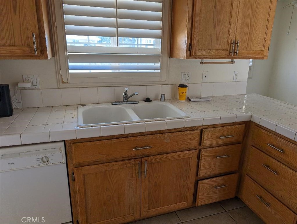 5331 Sunnyside Drive Riverside, CA 92504 - Photo 13 of 25 a kitchen with a sink and cabinets