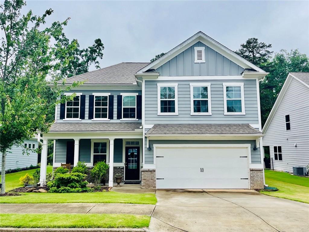 3015 Winding Ridge Waleska, GA 30183 - Photo 1 of 40 a front view of a house with a yard