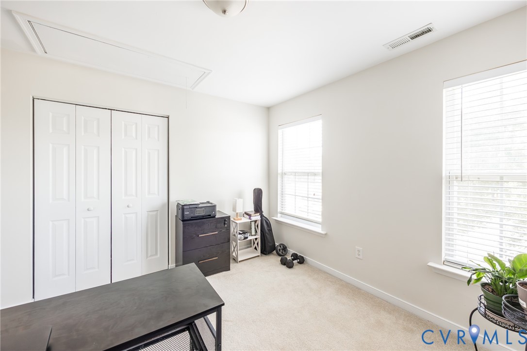 2928 Heather Ridge Drive Henrico, VA 23231 - Photo 31 of 34 Bright room featuring light-toned carpeting, two w