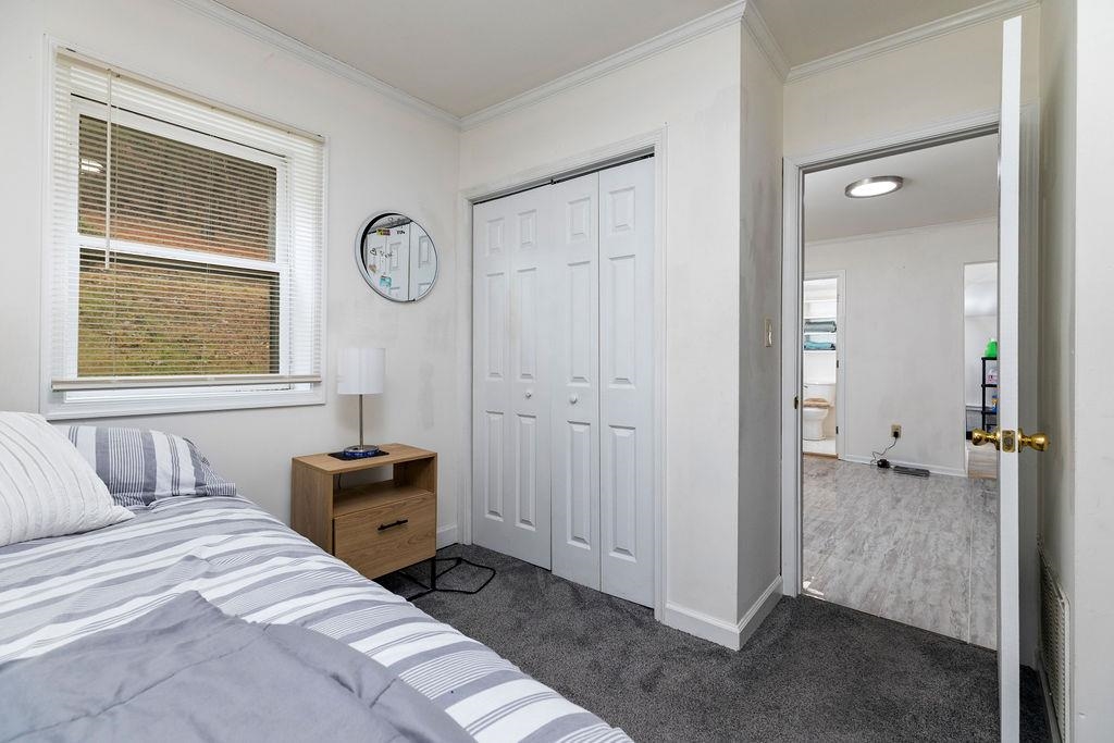 1623 East Main Street Waynesboro, VA 22980 - Photo 12 of 20 a bedroom with a bed and a window