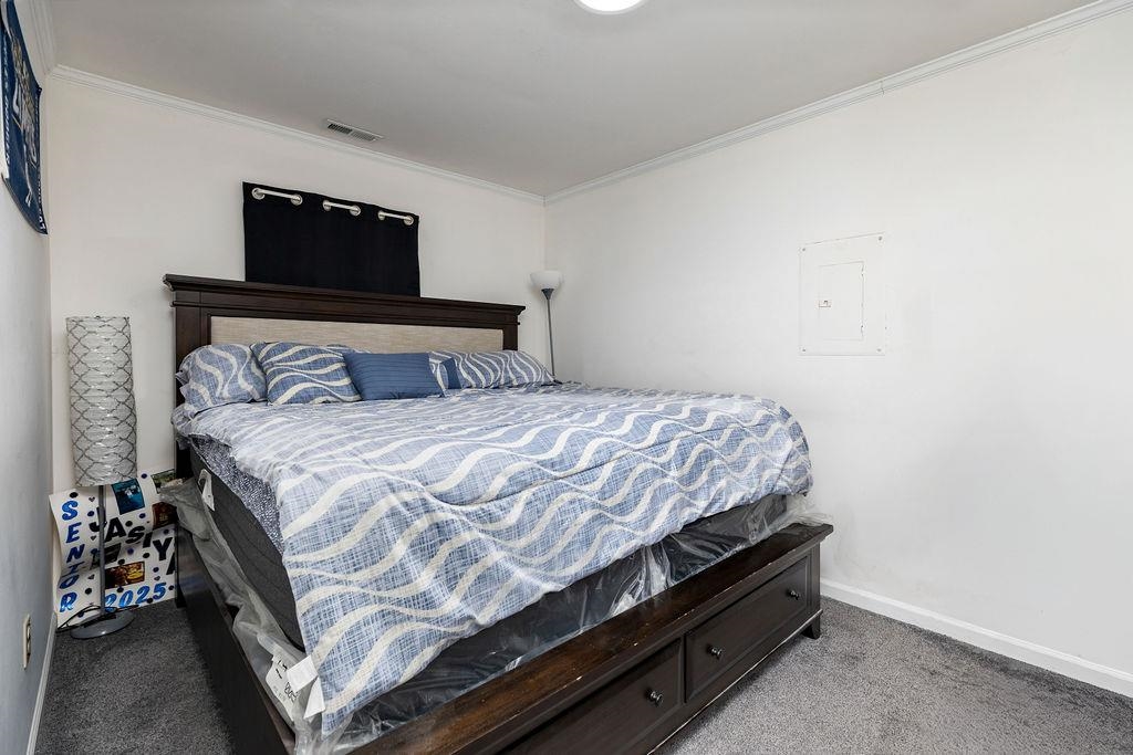 1623 East Main Street Waynesboro, VA 22980 - Photo 13 of 20 a bedroom with a bed and a tv