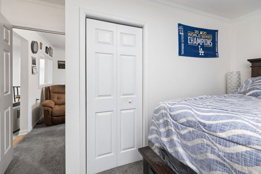 1623 East Main Street Waynesboro, VA 22980 - Photo 14 of 20 a bedroom with a bed and a couch