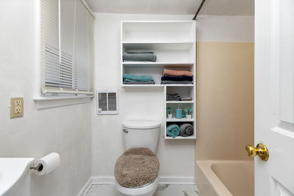 1623 East Main Street Waynesboro, VA 22980 - Photo 15 of 20 a bathroom with a toilet and a sink