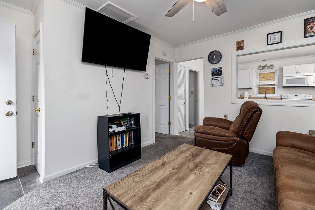 1623 East Main Street Waynesboro, VA 22980 - Photo 6 of 20 a living room with furniture and a flat screen tv