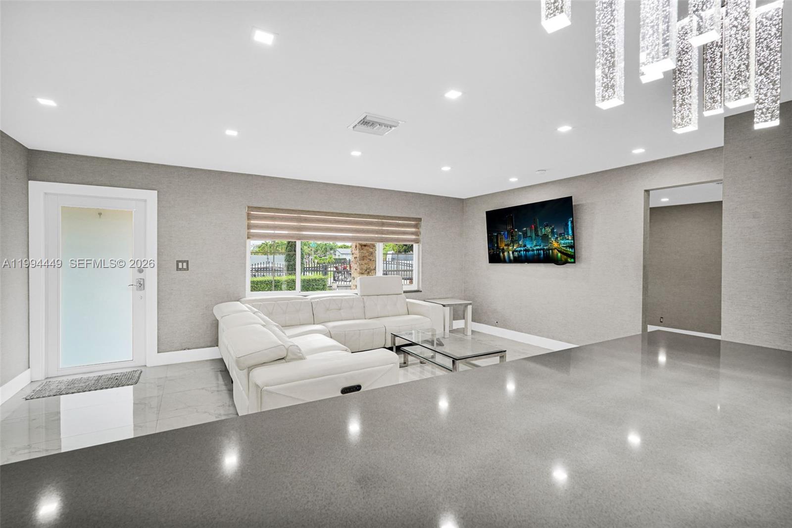 4225 Southwest 133rd Court Miami, FL 33175 - Photo 12 of 53 a living room with furniture and a flat screen tv