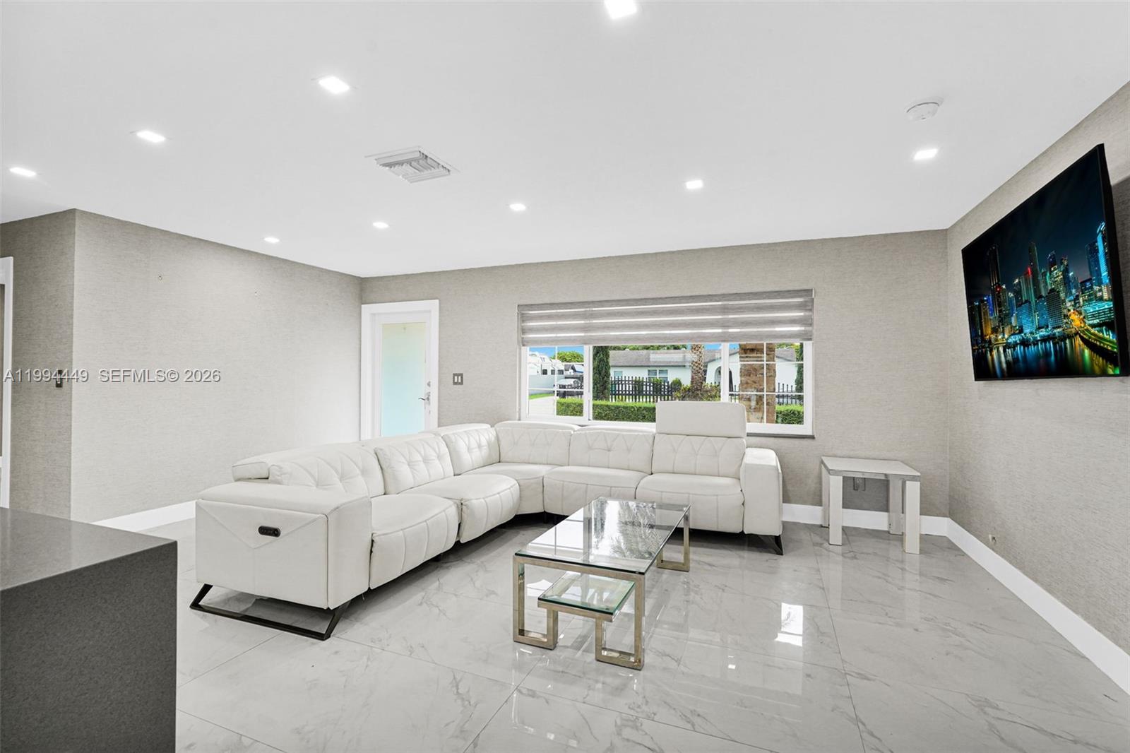 4225 Southwest 133rd Court Miami, FL 33175 - Photo 13 of 53 a living room with furniture and a flat screen tv
