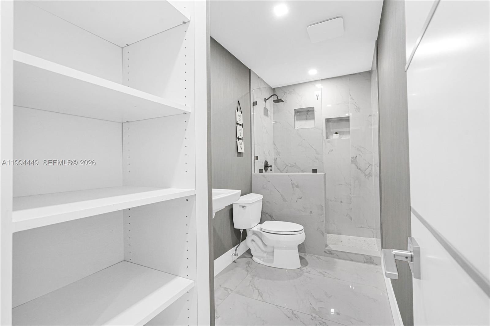 4225 Southwest 133rd Court Miami, FL 33175 - Photo 23 of 53 a bathroom with a toilet sink a shower and a mirror