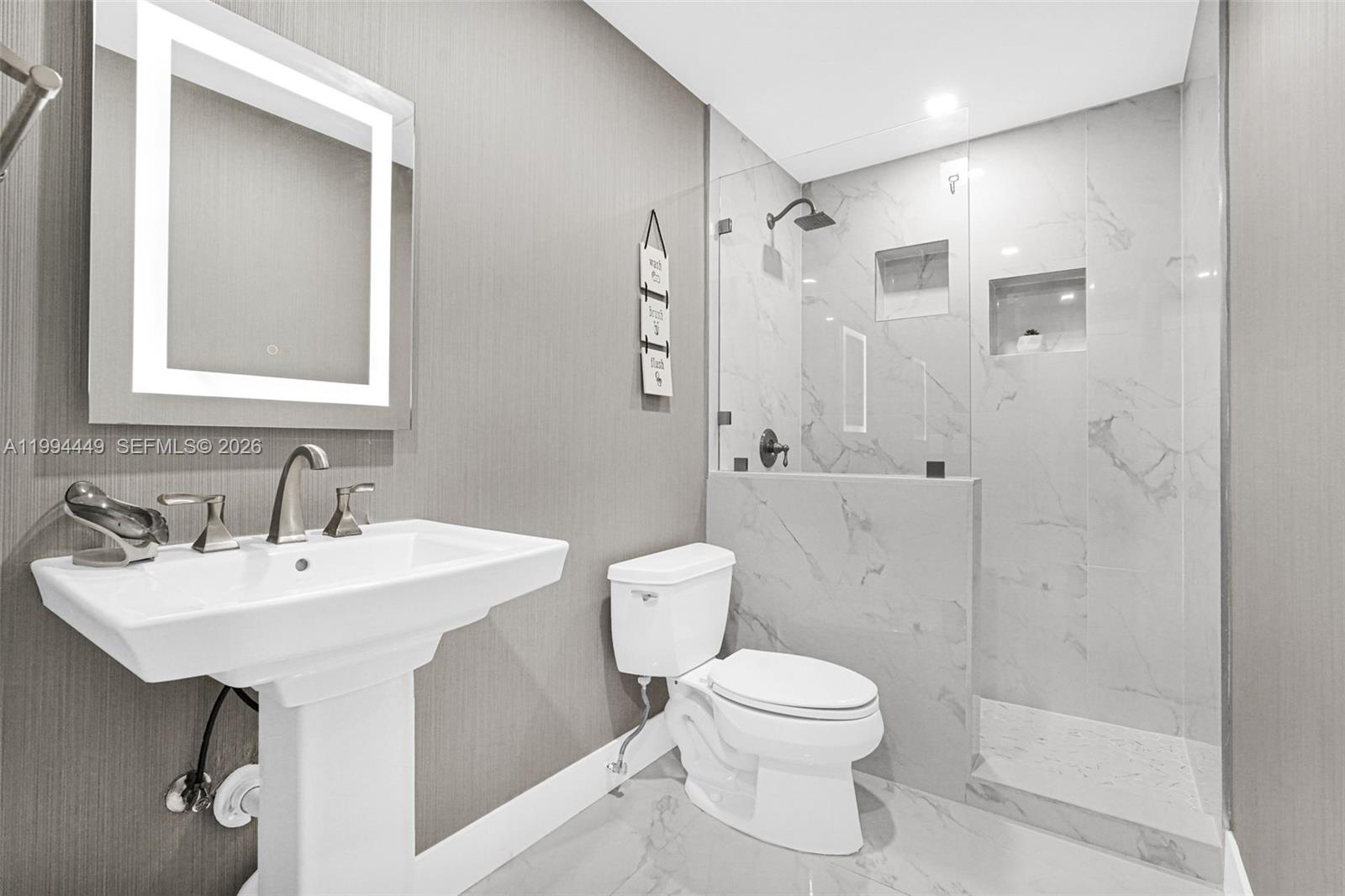 4225 Southwest 133rd Court Miami, FL 33175 - Photo 24 of 53 a bathroom with a toilet sink shower and mirror