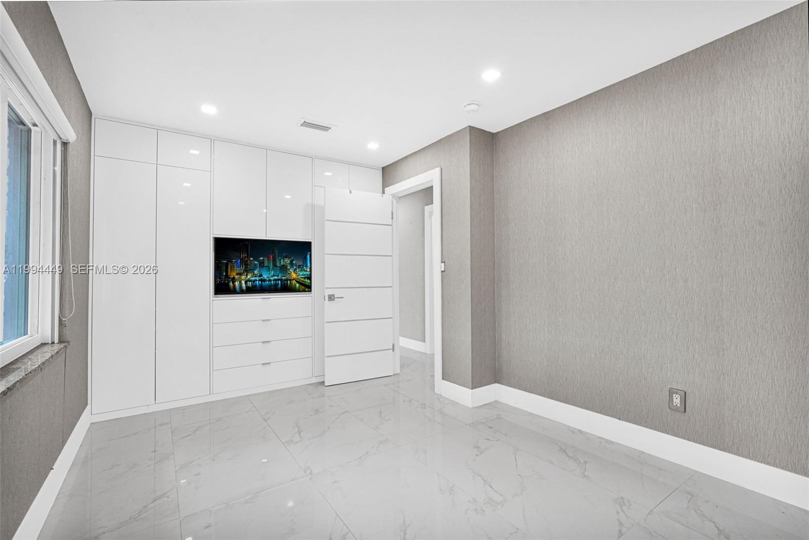 4225 Southwest 133rd Court Miami, FL 33175 - Photo 35 of 53 a view of a livingroom with an empty space and a window