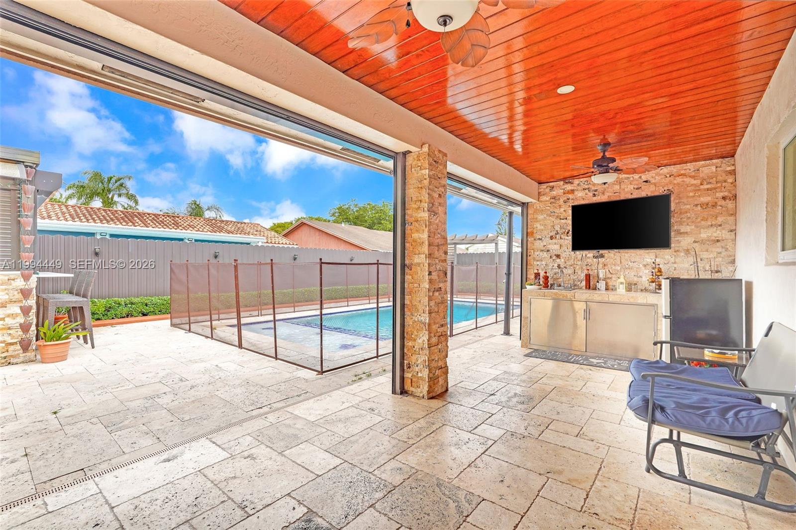 4225 Southwest 133rd Court Miami, FL 33175 - Photo 39 of 53 a view of a terrace with furniture and flat screen tv