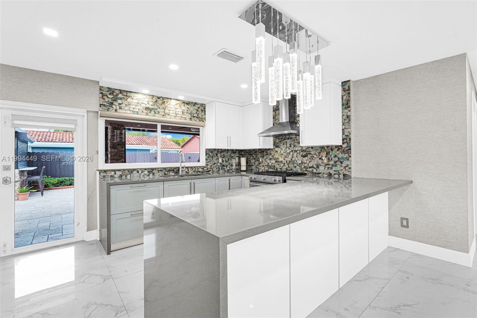 4225 Southwest 133rd Court Miami, FL 33175 - Photo 10 of 53 a kitchen with stainless steel appliances granite countertop a sink and a stove