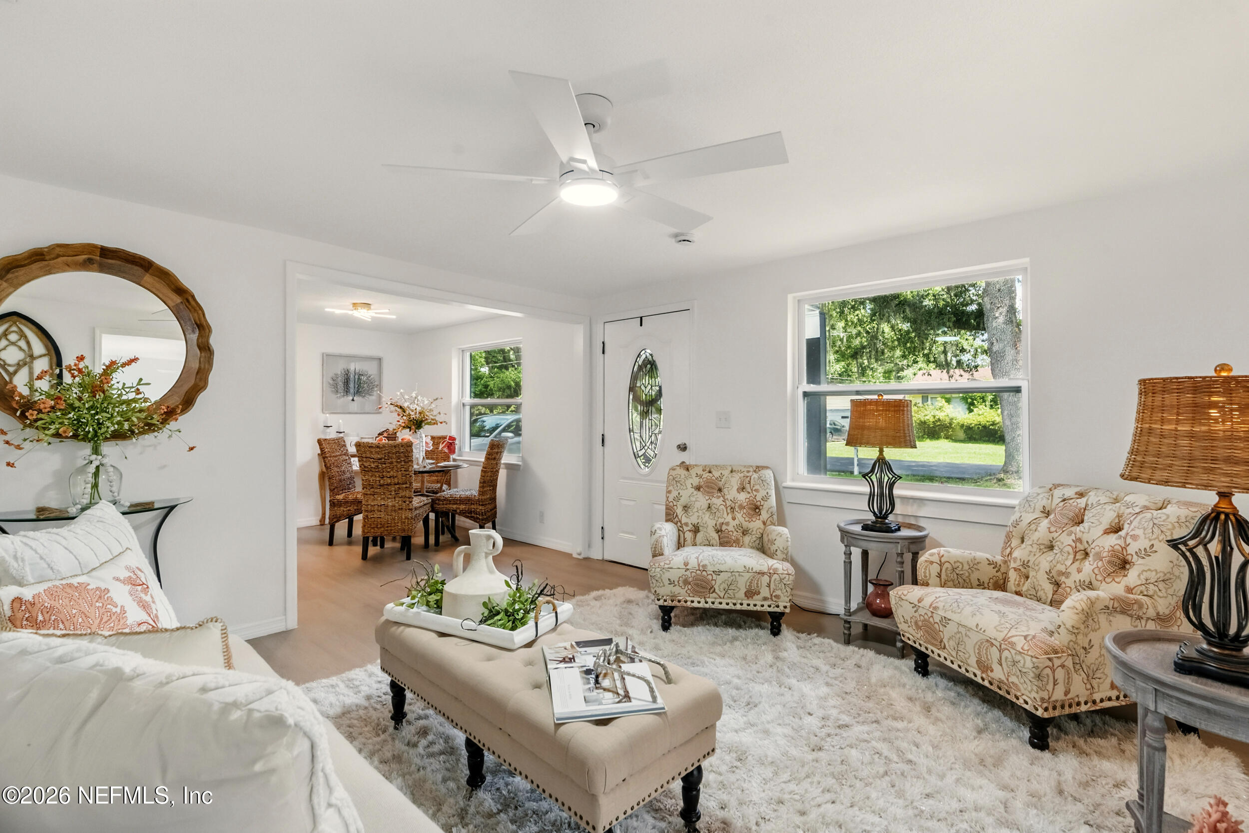 3530 Shadow Street Jacksonville, FL 32254 - Photo 1 of 32 a living room with furniture a chandelier and a window