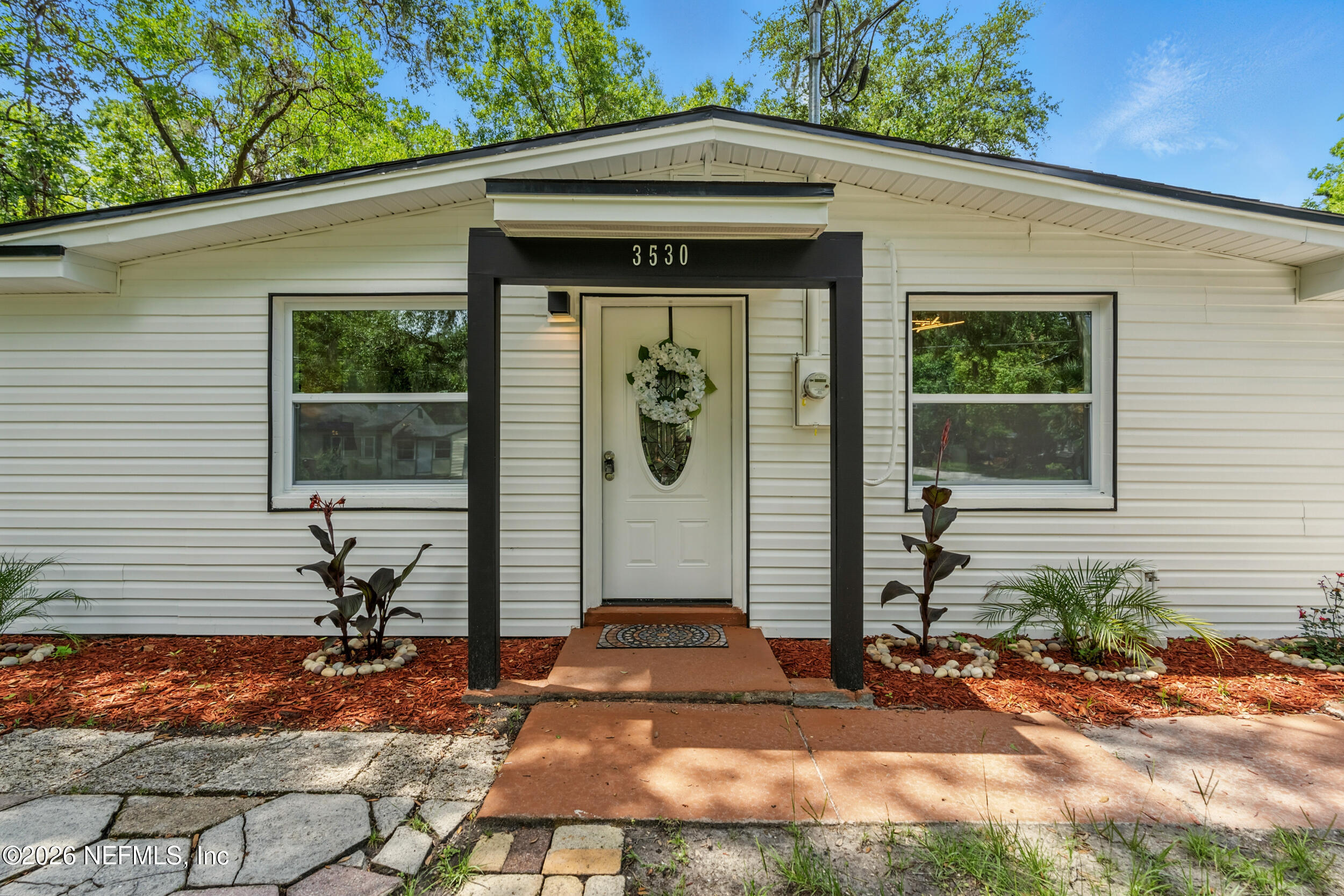 3530 Shadow Street Jacksonville, FL 32254 - Photo 11 of 32 a front view of a house with garden