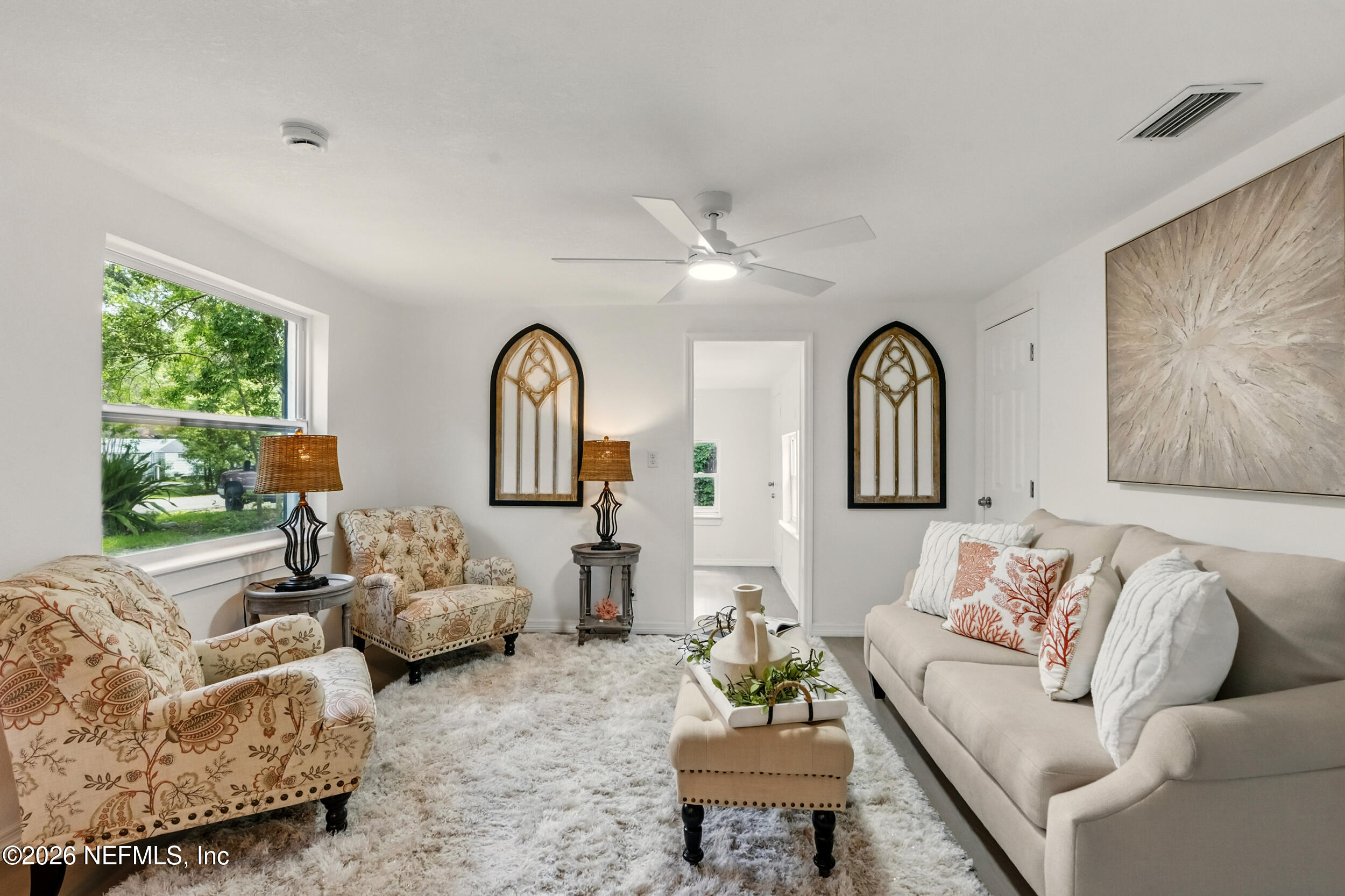 3530 Shadow Street Jacksonville, FL 32254 - Photo 13 of 32 a living room with furniture fireplace and a large window