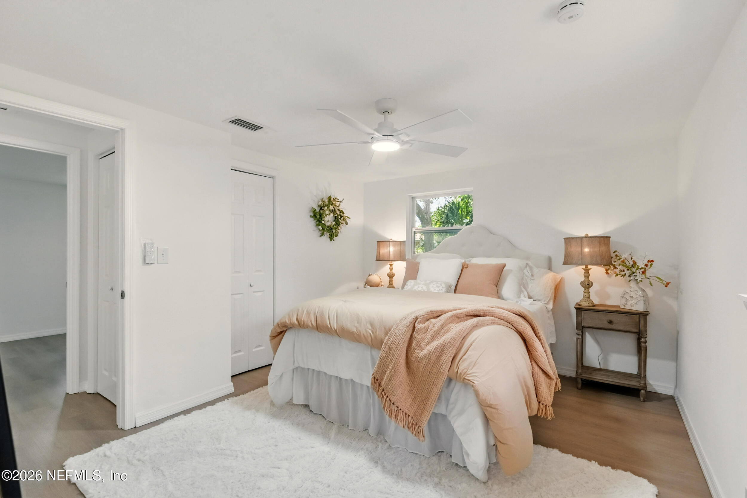 3530 Shadow Street Jacksonville, FL 32254 - Photo 18 of 32 a bedroom with a bed and a chandelier