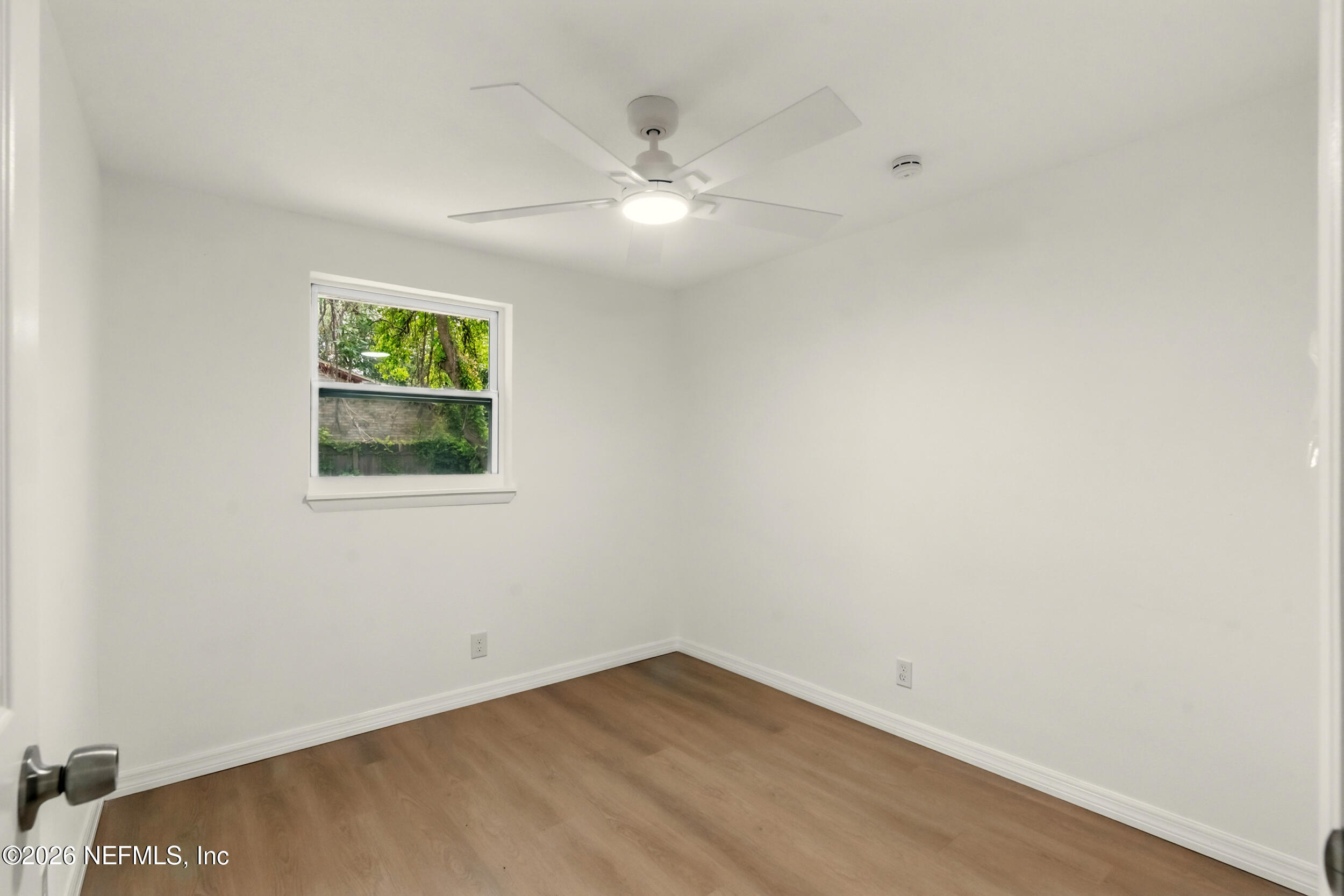 3530 Shadow Street Jacksonville, FL 32254 - Photo 21 of 32 an empty room with wooden floor and windows