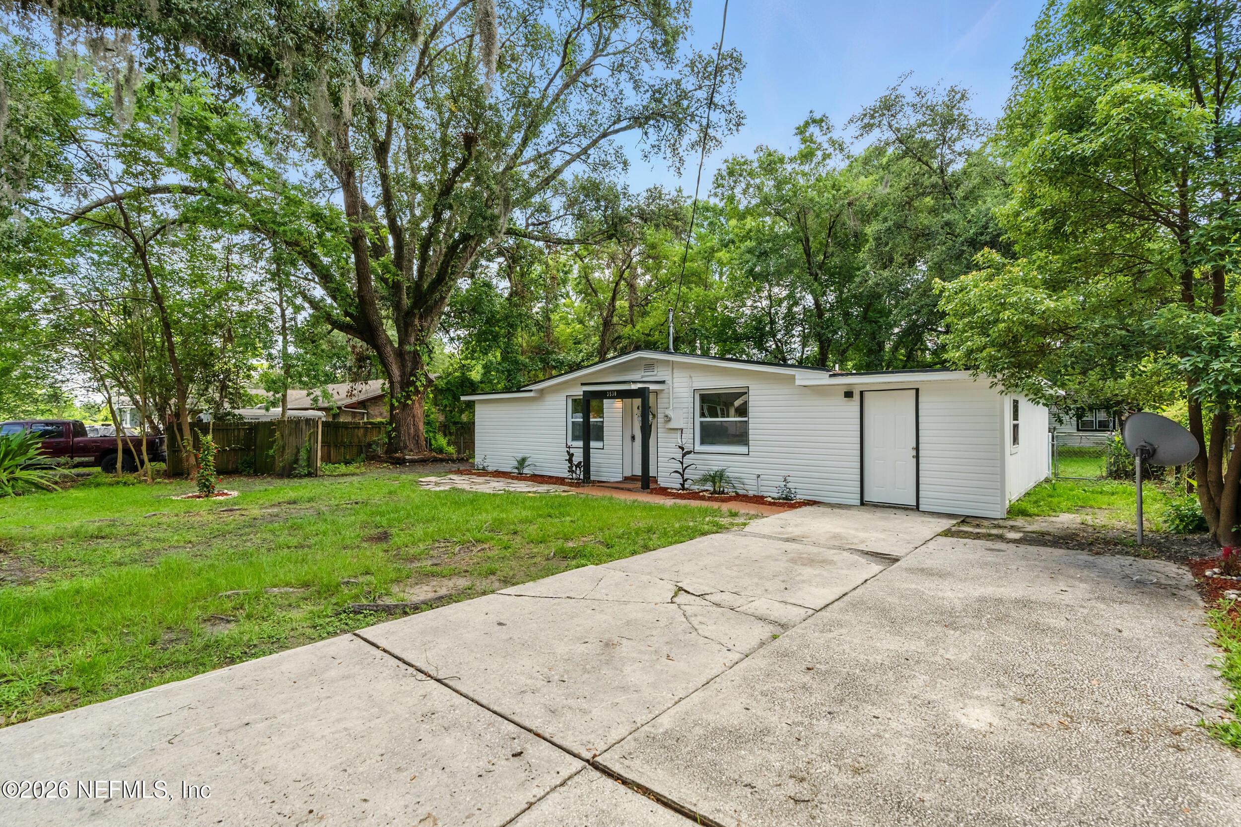 3530 Shadow Street Jacksonville, FL 32254 - Photo 25 of 32 a house with green field