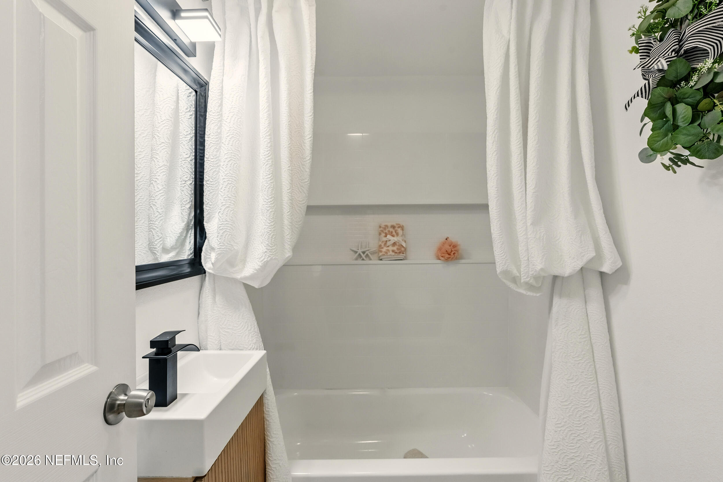 3530 Shadow Street Jacksonville, FL 32254 - Photo 7 of 32 a bathroom with a bathtub and a sink