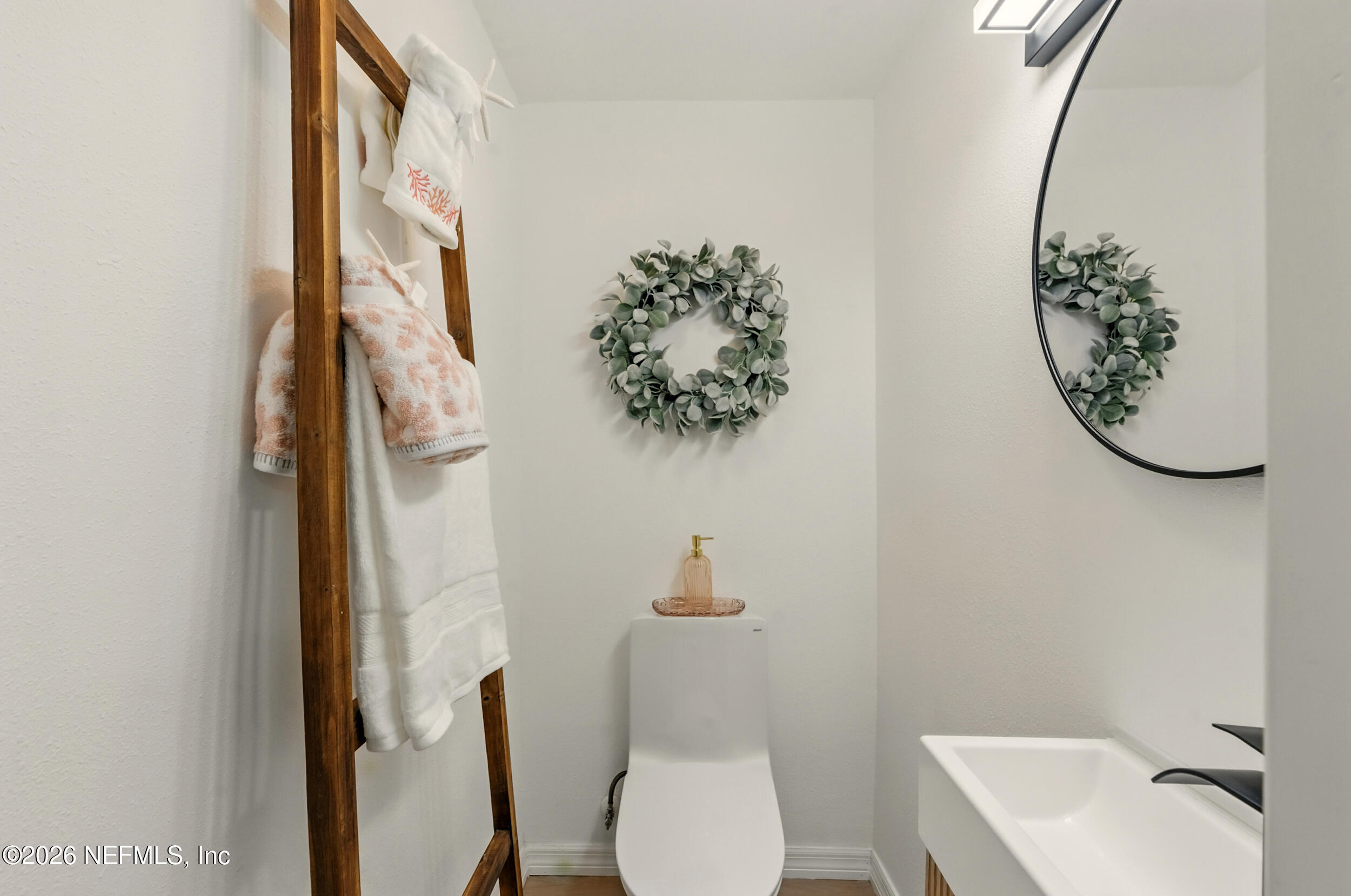 3530 Shadow Street Jacksonville, FL 32254 - Photo 8 of 32 a bathroom with a toilet and a sink