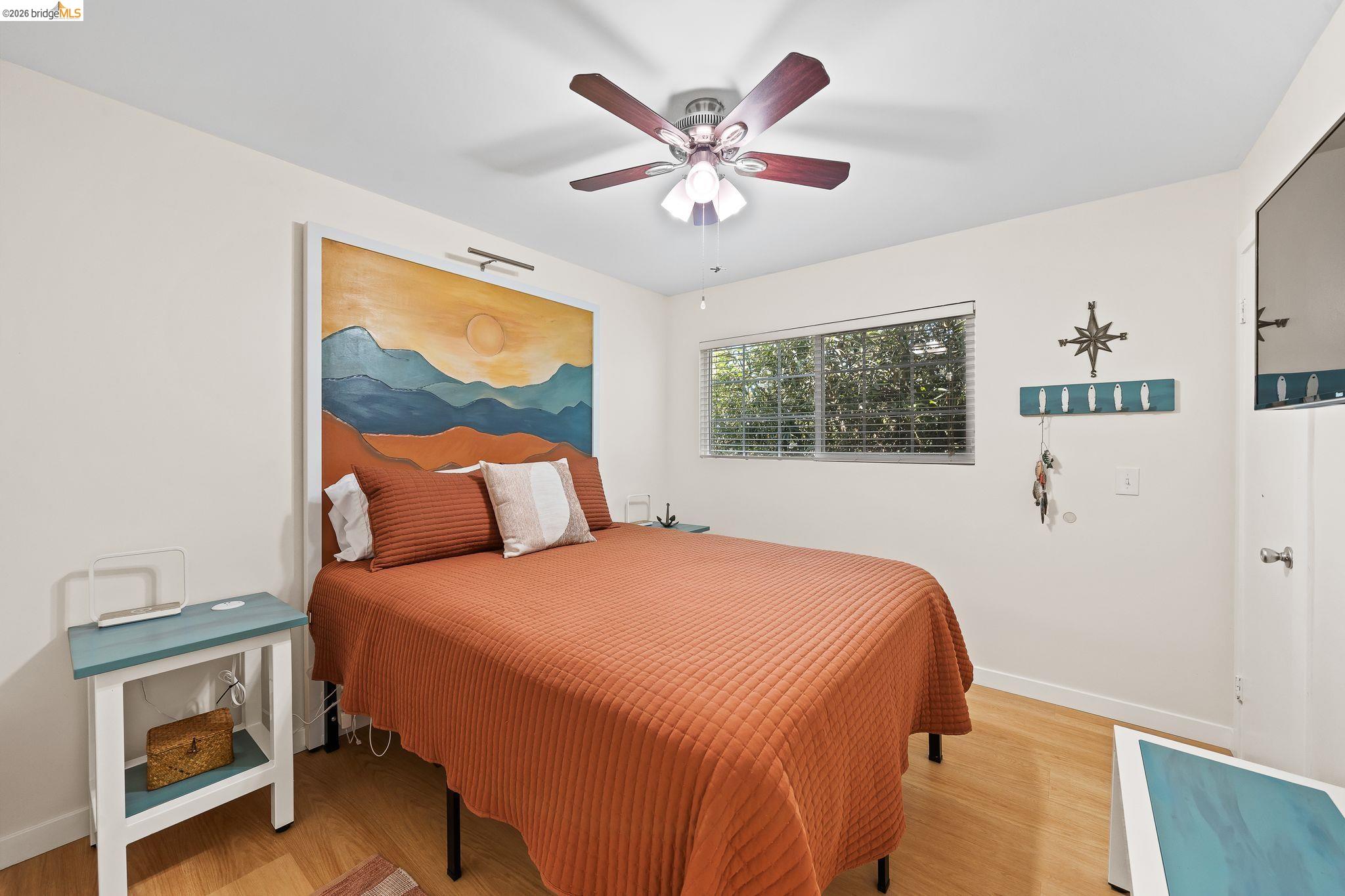 1704 Taylor Road Bethel Island, CA 94511 - Photo 20 of 73 Bright interior room featuring wood-finish flooring and a window with horizontal blinds